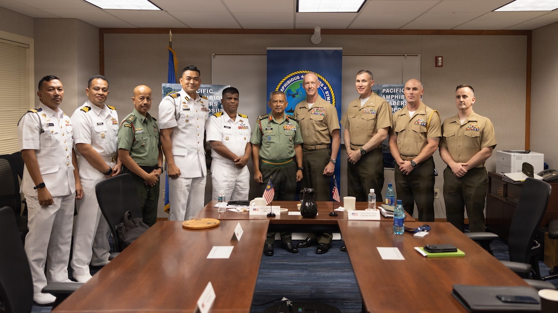 U.S. Marine Corps Lt. Gen. James F. Glynn, center, the commander of U.S. Marine Corps Forces, Pacific, poses for a photo with Malaysian Navy and Army senior leaders during a key leader engagement at the Pacific Amphibious Leaders Symposium 2026 in Honolulu, Hawaii, June 16, 2026. Bringing together experts and leaders from across the Indo-Pacific, PALS fosters collaboration among allied and partner amphibious and maritime forces to share knowledge and recent operational insights. This year was the 12th iteration of the symposium and hosted senior leaders from 25 participating nations who are committed to a free and open Indo-Pacific, with the objective of strengthening and developing regional relationships. (U.S. Marine Corps photo by Lance Cpl. Blake Gonter)