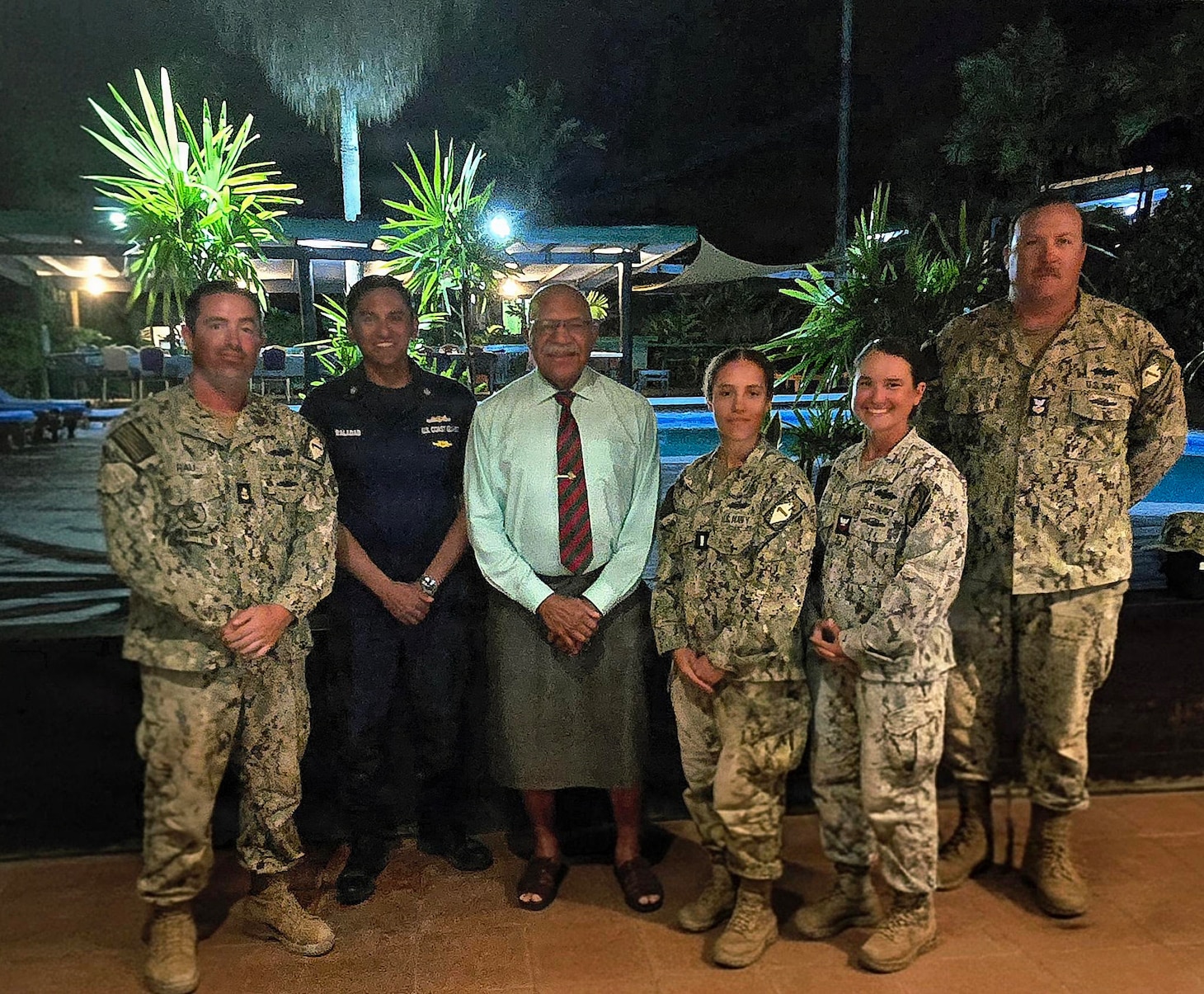 SAVUSAVU, Fiji (June 3, 2026) – The Hon. Sitiveni Rabuka, Prime Minister of Fiji, center, poses for a photo with a U.S. Coast Guardsman and Sailors, assigned to Naval Mobile Construction Battalion (NMCB) 1, during a visit to discuss their two-room schoolhouse construction project at Nabua Village in SavuSavu, Fiji, June 3, 2026.