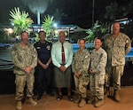 SAVUSAVU, Fiji (June 3, 2026) – The Hon. Sitiveni Rabuka, Prime Minister of Fiji, center, poses for a photo with a U.S. Coast Guardsman and Sailors, assigned to Naval Mobile Construction Battalion (NMCB) 1, during a visit to discuss their two-room schoolhouse construction project at Nabua Village in SavuSavu, Fiji, June 3, 2026.