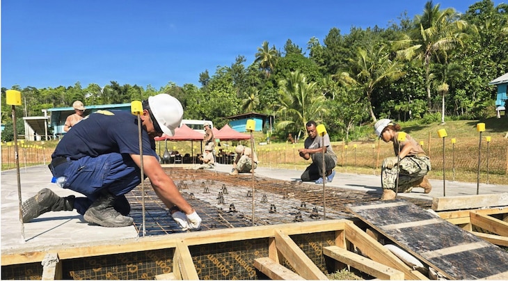 SAVUSAVU, Fiji (June 5, 2026) – U.S. Navy Cmdr. Nathaniel Baladad, left, Sailors assigned to Naval Mobile Construction Battalion (NMCB) 1, and local Nabua villagers reinforce steel and welded wire fabric for the Nabua Schoolhouse Project as part of Pacific Partnership 2026 in Savusavu, Fiji, June 5, 2026.