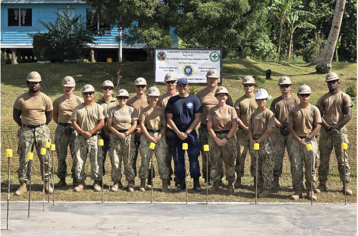 SAVUSAVU,Fiji (June 5, 2026) – U.S. Navy Cmdr. Nathaniel Baladad, center, and Sailors assigned to Naval Mobile Construction Battalion (NMCB) 1, pose for a photo while overlooking concrete slabs for the Nabua Schoolhouse Project as part of Pacific Partnership 2026 in Savusavu, Fiji, June 5, 2026.