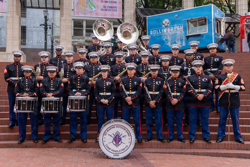 U.S. Marine Corps Gunnery Sgt. Craig Palmer, a drum master with the 1st Marine Division Band, leads on the march in the Grand Floral Starlight Parade during the Portland Rose Festival Fleet Week, in Portland, Oregon, June 6, 2026. The Portland Rose Festival was a part of Portland Fleet Week and provided the opportunity to build community relations for the citizens of Oregon to interact with Marines, Sailors and Coast Guardsmen. Palmer is a native to Tennessee. (U.S. Marine Corps photo by Cpl. Stella Tedesco)