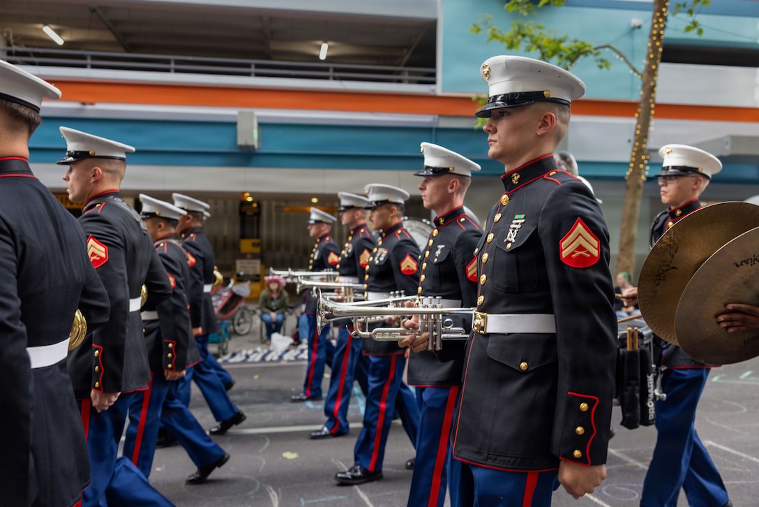 U.S. Marines with the 1st Marine Division Band, march in the Grand Floral Starlight Parade during the Portland Rose Festival Fleet Week, in Portland, Oregon, June 6, 2026. The Portland Rose Festival was a part of Portland Fleet Week and provided the opportunity to build community relations for the citizens of Oregon to interact with Marines, Sailors and Coast Guardsmen. (U.S. Marine Corps photo by Cpl. Stella Tedesco)