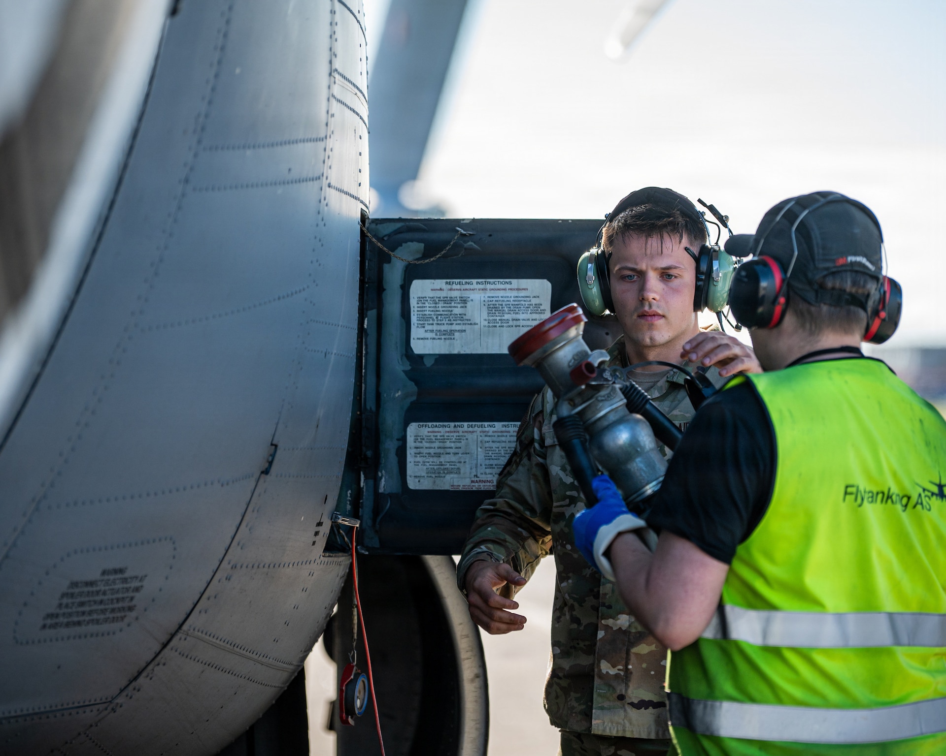 U.S. Air Force Staff Sgt. Ethan Hall, left, a crew chief assigned to the 123rd Maintenance Squadron, 123rd Airlift Wing, Kentucky Air National Guard, refuels a C-130J Super Hercules aircraft during an airlift mission after its arrival to Bodø, Norway, for exercise Ramstein Flag, June 15, 2026. The 123rd AW is providing tactical airlift support to NATO Allies throughout the month of June in support of Ramstein Flag 2026, an Allied Air Command large-scale, multi-location and joint operating area exercise with 18 participating nations and more than 200 aircraft. (U.S. Air National Guard photo by Senior Airman Annaliese Billings)