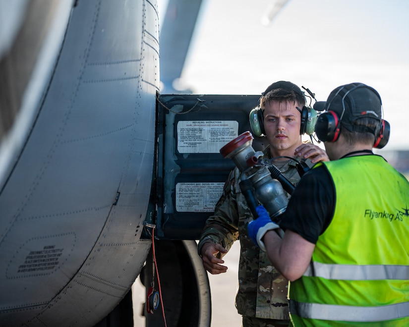 U.S. Air Force Staff Sgt. Ethan Hall, left, a crew chief assigned to the 123rd Maintenance Squadron, 123rd Airlift Wing, Kentucky Air National Guard, refuels a C-130J Super Hercules aircraft during an airlift mission after its arrival to Bodø, Norway, for exercise Ramstein Flag, June 15, 2026. The 123rd AW is providing tactical airlift support to NATO Allies throughout the month of June in support of Ramstein Flag 2026, an Allied Air Command large-scale, multi-location and joint operating area exercise with 18 participating nations and more than 200 aircraft. (U.S. Air National Guard photo by Senior Airman Annaliese Billings)