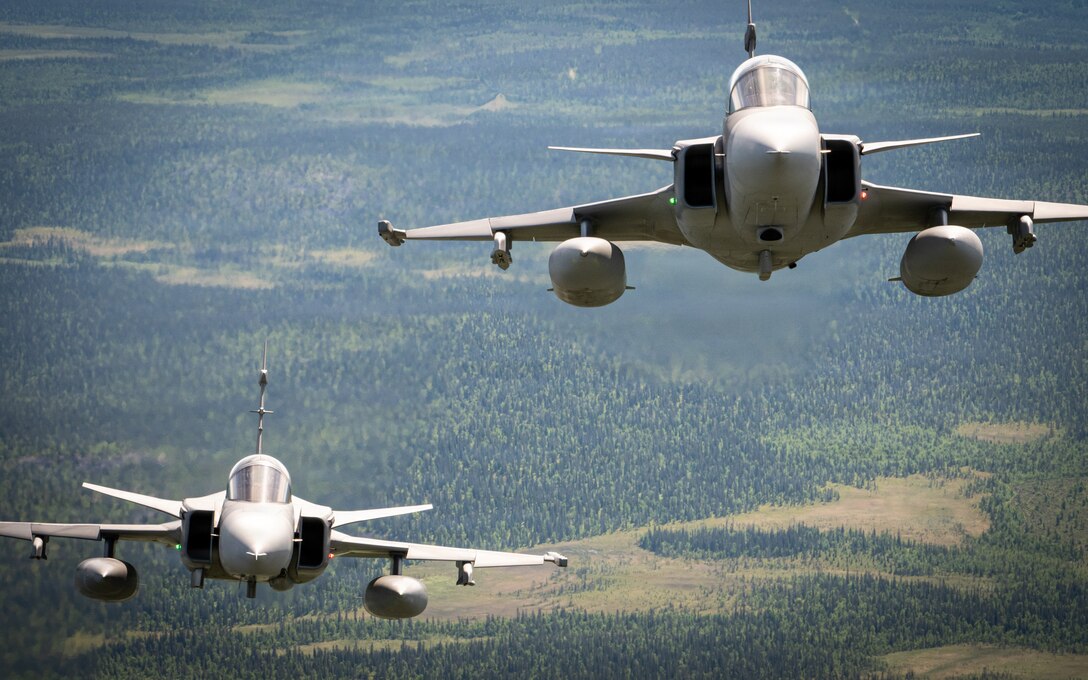 A Czech JAS 39C/D Gripen fighter jet from the Czech Air Force, left, flies with a Swedish JAS 39 Gripen fighter jet with the Swedish Air Force, right, alongside other NATO Allied aircraft in a special formation flight over Finland during exercise Ramstein Flag, June 16, 2026. Ramstein Flag 2026 is a complex, large-scale, tactical-level exercise which demonstrates NATO’s determination to counter modern and emerging threats through distributed operations. (U.S. Air National Guard photo by Senior Airman Annaliese Billings)
