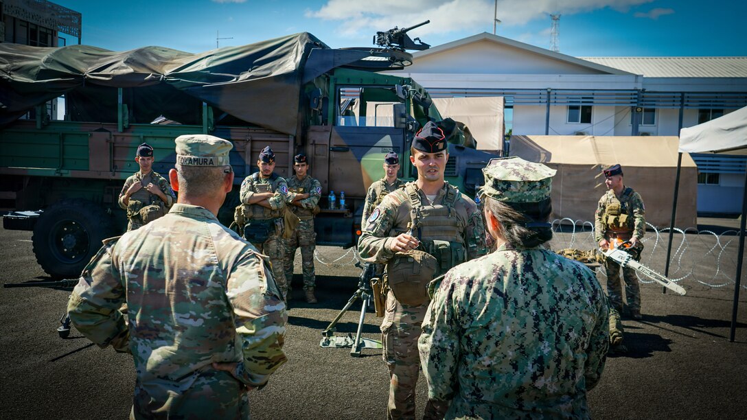 Maj. Gen. Lance Okamura, deputy commanding general of U.S. Army Pacific–Homeland Affairs, and Rear Adm. Suzanne Bailey, deputy commander of U.S. Third Fleet, receive a capability brief from a French Armed Forces in French Polynesia service member during a distinguished visitor day for Exercise MARARA 26 in Tahiti, French Polynesia, June 16, 2026.