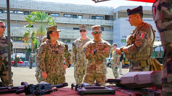 Rear Adm. Suzanne Bailey, deputy commander of U.S. Third Fleet, and Maj. Gen. Lance Okamura, deputy commanding general of U.S. Army Pacific–Homeland Affairs, observe equipment and technology displayed by the French Armed Forces in French Polynesia during Exercise MARARA 26 in Tahiti, French Polynesia, June 16, 2026