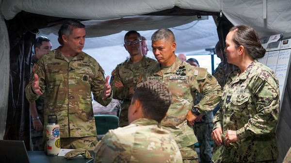 Maj. Gen. Lance Okamura, deputy commanding general of U.S. Army Pacific–Homeland Affairs, and Rear Adm. Suzanne Bailey, deputy commander of U.S. Third Fleet, receive an operational briefing from Lt. Col. Matt Sawdy, operations officer assigned to 322 Civil Affairs Brigade, inside the Joint Force Headquarters during a distinguished visitor day for Exercise MARARA 26 in Tahiti, French Polynesia, June 16, 2026.