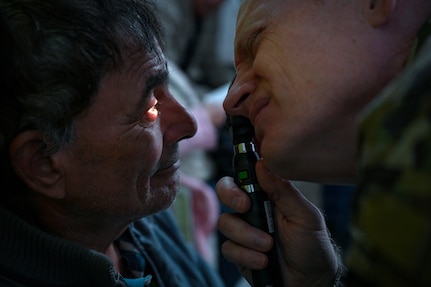 U.S. Air Force Lt. Col. Kirk Drennan, an optometrist with the Utah Air National Guard’s 151st Medical Group, performs an eye exam at Unidad de Salud Familiar Niño de Jesús in Asuncion, Paraguay June 18, 2026, as part of exercise Amistad 2026.