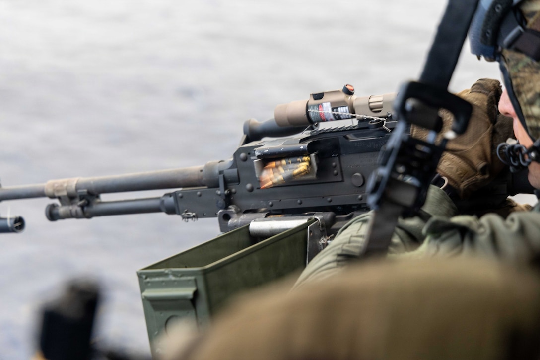 A UH-1Y Venom crew chief with Marine Medium Tiltrotor Squadron (VMM) 365 (Reinforced), Littoral Combat Force-24, fires a M240-D machine gun during an aerial gun range while over the Caribbean Sea, June 8, 2026. U.S. military forces are deployed to the U.S. Southern Command area of responsibility in support of Operation SOUTHERN SPEAR, Department of War-directed operations, and the president’s priorities to disrupt illicit drug trafficking, deter malign actors and protect the homeland through continuous presence. (U.S. Marine Corps photo)