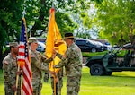 Command Sgt. Maj. Dallas J. Scott holds the battalion guidon during the reorganization ceremony transitioning the 2nd Battalion, 116th Combined Arms Battalion to the 2nd Battalion, 116th Cavalry Regiment, June 18, 2026, at Gowen Field, Boise, Idaho. The battalion guidon represents the unit's identity, lineage, and honors. Scott's role in the ceremony reflected his responsibility to uphold the battalion's standards and traditions through its reorganization. Photo by Sgt. Rusty Rehl.