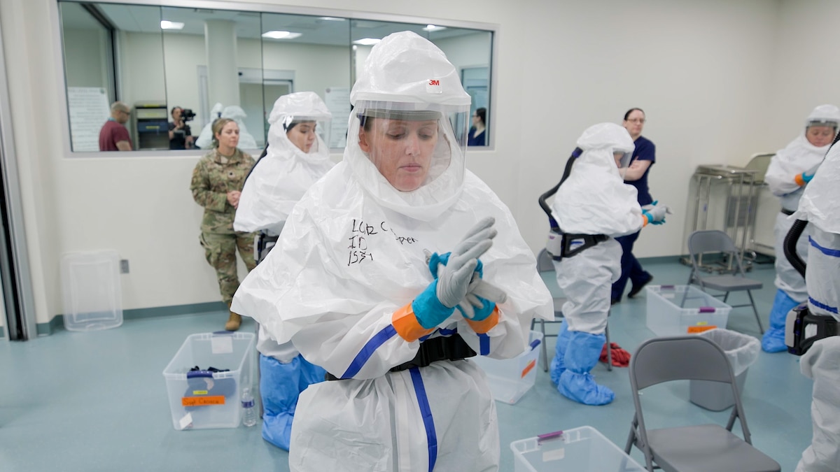 Medical personnel at the Center for Sustainment of Trauma and Readiness Skills (C-STARS) Omaha secure personal protective equipment before infectious control training at the University of Nebraska Medical Center, June 14, 2024.