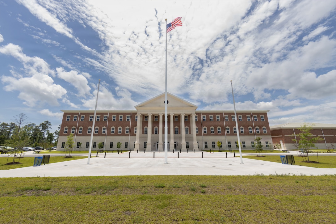 Exterior stock photographs of the newly completed II Marine Expeditionary Force Headquarters were captured for historical documentation, archival purposes and future command information products at Marine Corps Base Camp Lejeune, North Carolina, May 27, 2026. The 180,251-square-foot facility was constructed to enhance command and control, operational planning and overall readiness capabilities for II MEF, and includes administrative spaces, the Littoral Warfare Training Center and a 24/7 watch floor supporting real-time operational awareness and mission execution across the force. (U.S. Marine Corps photo by Sgt. DeMontae Stovall)