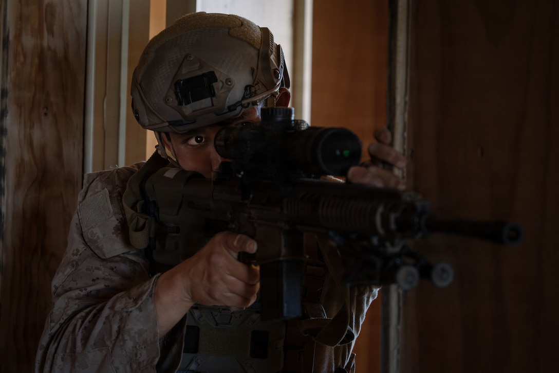 A U.S. Marine Corps scout with 2nd Battalion, 24th Marines, 4th Marine Division, aims an M110 semi-automatic sniper system at simulated enemies as part of an information and intelligence integration course during Integrated Training Exercise 3-26, Marine Corps Air Ground Combat Center Twentynine Palms, California, June 8, 2026. ITX is designed to generate combat readiness and ensure the Reserve Component provides critical strategic depth to the Total Force. From complex combined arms maneuvers to all-domain integration, these Marines are proving that they are ready to augment, reinforce, and fight alongside the active component at a moment's notice. (U.S. Marine Corps photo by Cpl. Van Hoang)