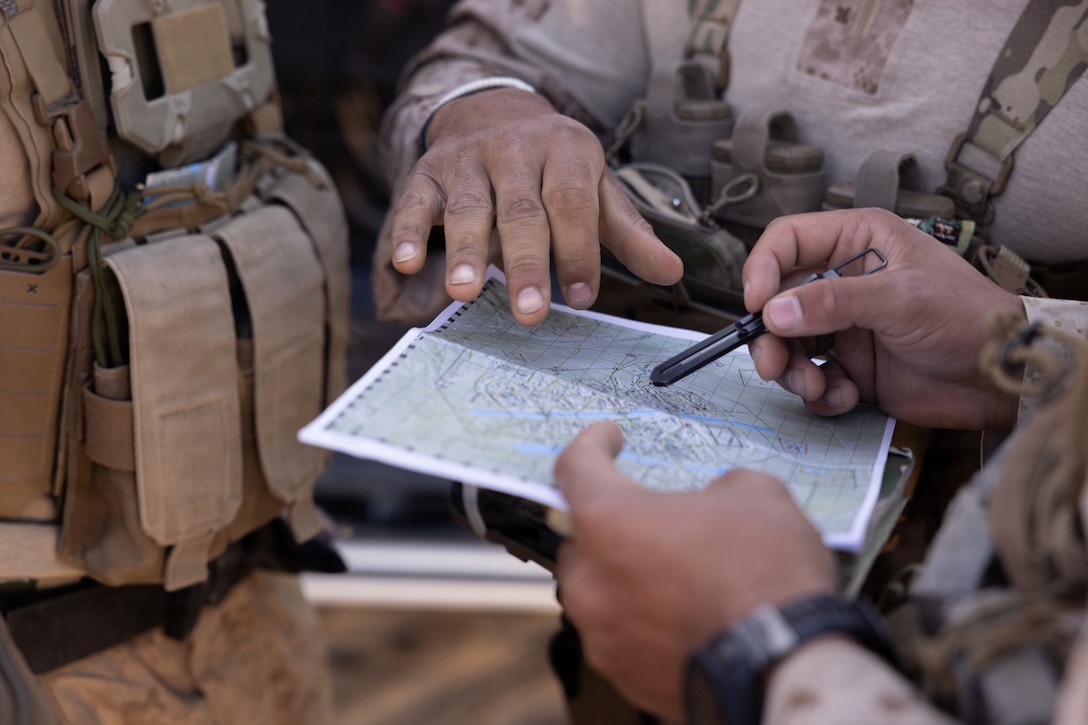 U.S. Marine Corps scouts with 2nd Battalion, 24th Marines, 4th Marine Division, are briefed on setting a listening and observing post in a military operation on urban terrain town as part of an information and intelligence integration course during Integrated Training Exercise 3-26, Marine Corps Air Ground Combat Center Twentynine Palms, California, June 8, 2026. ITX is designed to generate combat readiness and ensure the Reserve Component provides critical strategic depth to the Total Force. From complex combined arms maneuvers to all-domain integration, these Marines are proving that they are ready to augment, reinforce, and fight alongside the active component at a moment's notice. (U.S. Marine Corps photo by Cpl. Van Hoang)