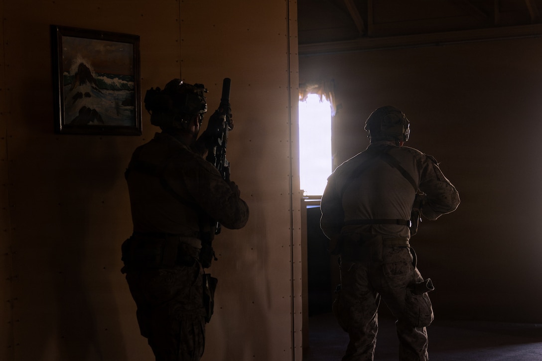 U.S. Marine Corps scouts with 2nd Battalion, 24th Marines, 4th Marine Division, clear a building in a military operation on urban terrain town as part of an information and intelligence integration course during Integrated Training Exercise 3-26, Marine Corps Air Ground Combat Center Twentynine Palms, California, June 8, 2026. ITX is designed to generate combat readiness and ensure the Reserve Component provides critical strategic depth to the Total Force. From complex combined arms maneuvers to all-domain integration, these Marines are proving that they are ready to augment, reinforce, and fight alongside the active component at a moment's notice. (U.S. Marine Corps photo by Cpl. Van Hoang)