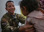 U.S. Army Capt. Brad Daniels-Demers, a nurse practitioner with the Massachusetts Army Guard’s Medical Detachment, listens to a patient’s lungs with a stethoscope at Unidad de Salud Familiar Niño de Jesús in Asuncion, Paraguay June 18, 2026, as part of exercise Amistad 2026. More than 20 National Guard members from Arkansas, Colorado, Iowa, Massachusetts, Rhode Island and Utah are taking part in the two-week exercise aimed at strengthening partnerships and regional health security. Photo by Master Sgt. Whitney Hughes.