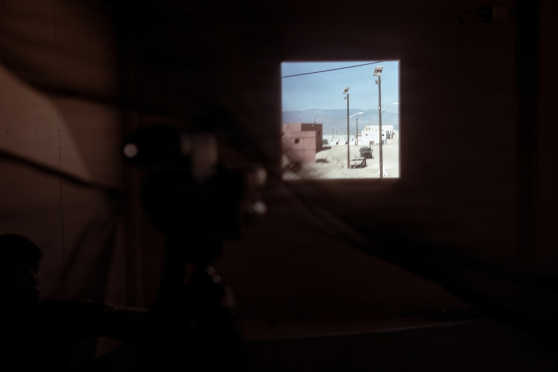 A simulated enemy convoy passes U.S. Marine Corps scouts with 2nd Battalion, 24th Marines, 4th Marine Division, as part of an information and intelligence integration course during Integrated Training Exercise 3-26, Marine Corps Air Ground Combat Center Twentynine Palms, California, June 8, 2026. ITX is designed to generate combat readiness and ensure the Reserve Component provides critical strategic depth to the Total Force. From complex combined arms maneuvers to all-domain integration, these Marines are proving that they are ready to augment, reinforce, and fight alongside the active component at a moment's notice. (U.S. Marine Corps photo by Cpl. Van Hoang)