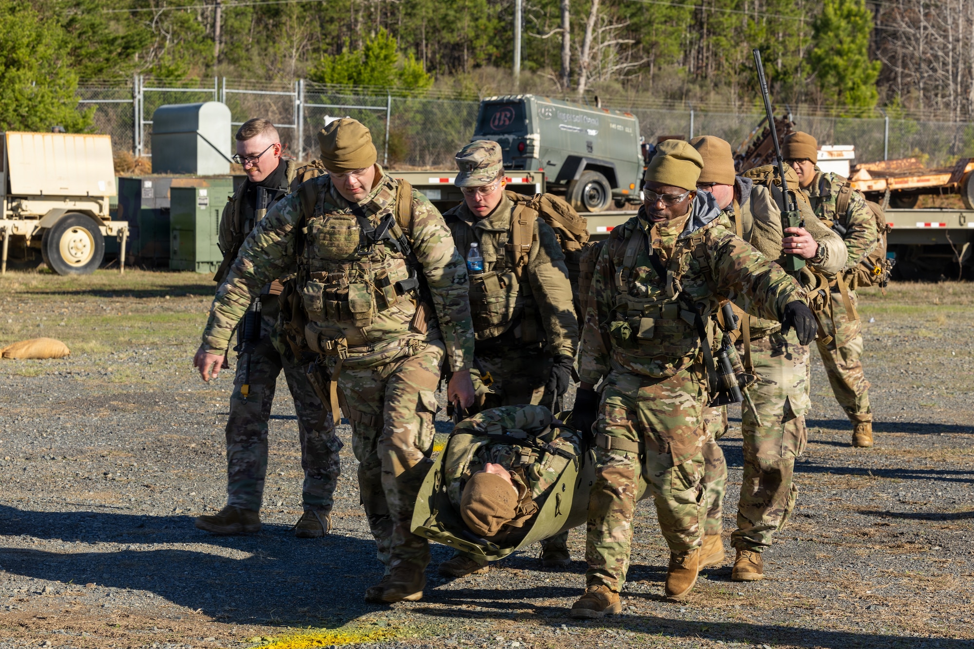 U.S. Airmen carry a simulated injured patient to a casualty collection point during the Warrior Skills Course (WSC) at the New London Air National Guard Base, New London, N.C., March 13, 2026.