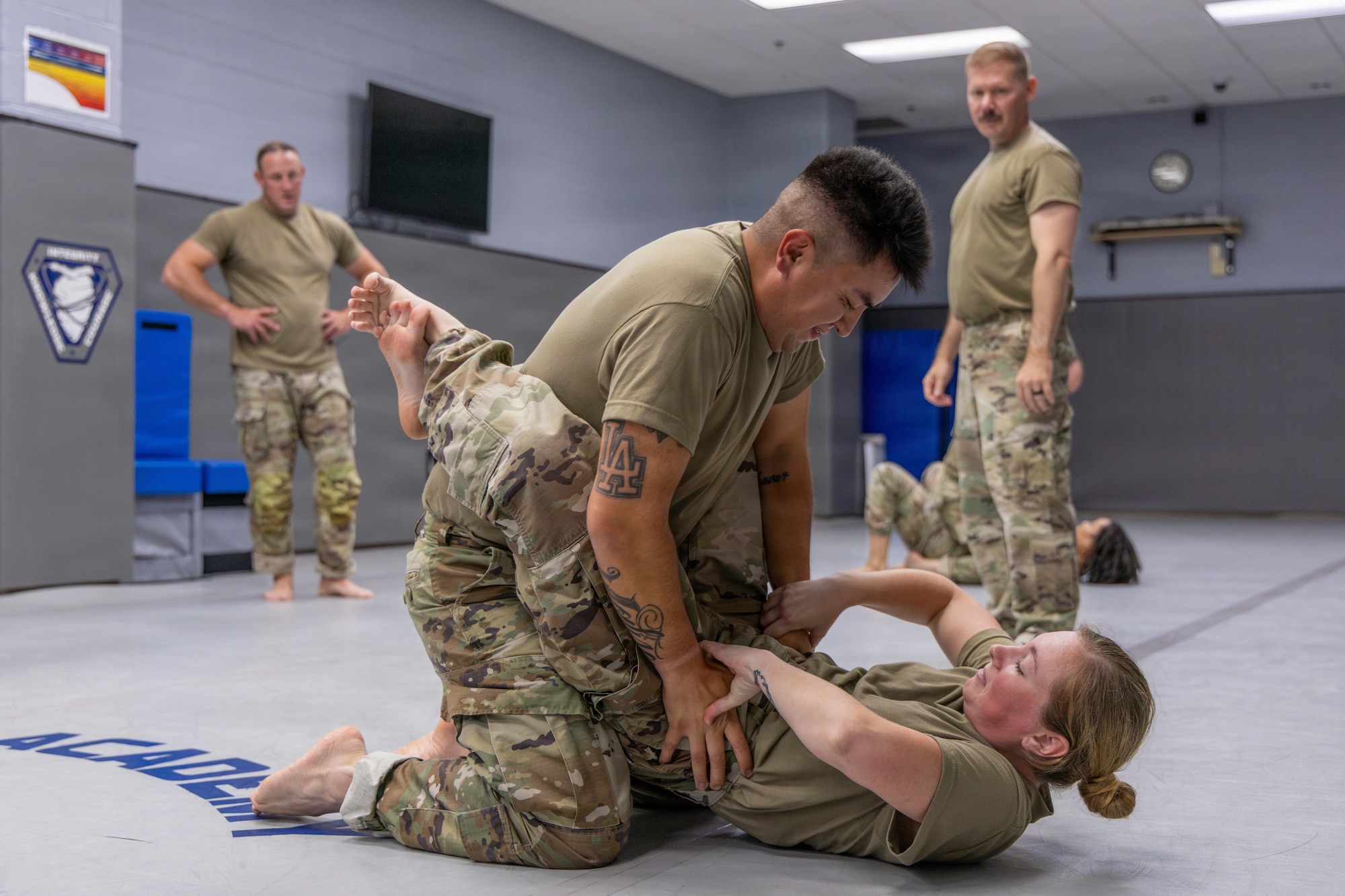 U.S. Air Force Staff Sgt. Estevan R. Benavidez, 145th Security Forces Squadron (SFS), left, executes a close-guard position with Staff Sgt. Sydney Landon, 145th SFS, bottom, at the Charlotte-Mecklenburg Police Department Training Academy, Charlotte, N.C., May 2, 2026.