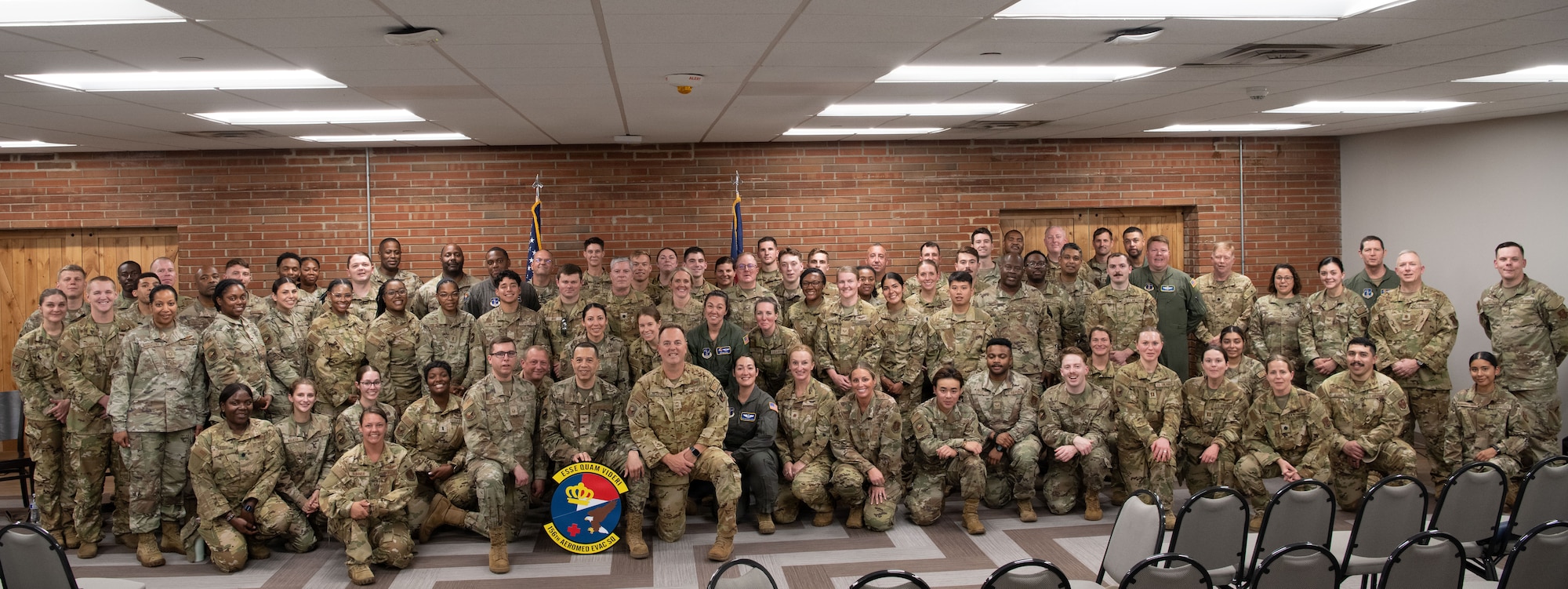 Members of the 156th Aeromedical Evacuation Squadron pose for a group photo during an emblem dedication ceremony on June 6, 2026, at the Charlotte Air National Guard base, N.C.