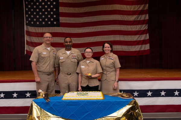 PORTSMOUTH, Va. (June 17, 2026)  Master Chief Hospital Corpsman Louis Raiford and Hospitalman Apprentice Winnie Li, both assigned to Navy Medicine Readiness Training Command (NMRTC) Portsmouth, take a group photo with NMRTC Portsmouth leadership during a ceremony for the hospital corpsman's 128th birthday at Naval Medical Center Portsmouth (NMCP), June 17, 2026. NMCP is the U.S. Navy’s premiere healthcare facility, having supported the maritime readiness of the U.S. Navy’s and U.S. Marine Corps’ forward-deployed units with high-quality medical care for nearly 200 years. NMRTC Portsmouth trains a staff of over 4,000 enlisted, commissioned, and civilian medical personnel across multiple specialties to provide high-quality medical care to patients at NMCP’s facilities and branch health clinics. (U.S. Navy photo by Mass Communication Specialist 2nd Class Thomas Boatright)