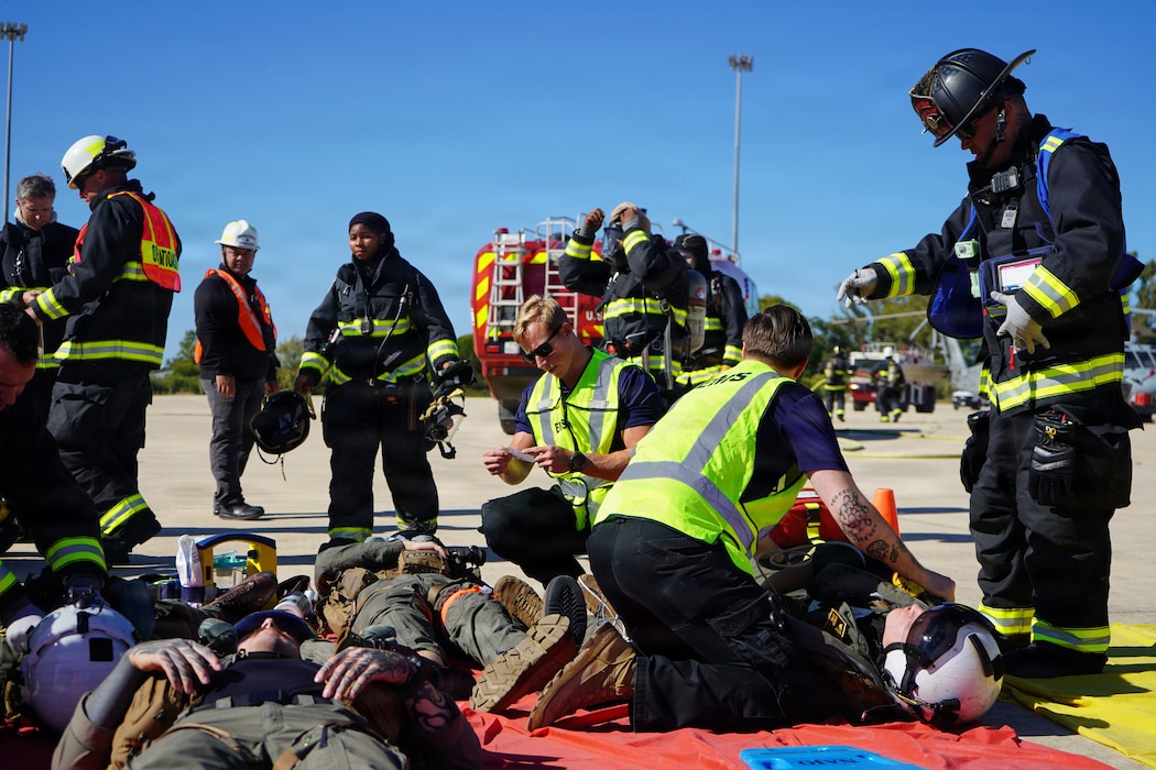 Hospital Corpsman 2nd Class John Paul Manikas and Hospital Corpsman 3rd Class Michael Blanchard, assigned to Naval Medical Readiness and Training Command (NMRTC) Rota, transport a simulated casualty during an Air Mishap exercise at Naval Station Rota, May 20, 2026. The training enhanced coordination among responding agencies and strengthened the readiness of Navy Medicine personnel to provide lifesaving care and medical support during operational, contingency, and emergency response missions. (U.S. Navy photo by Lt. Vanessa Bernales)