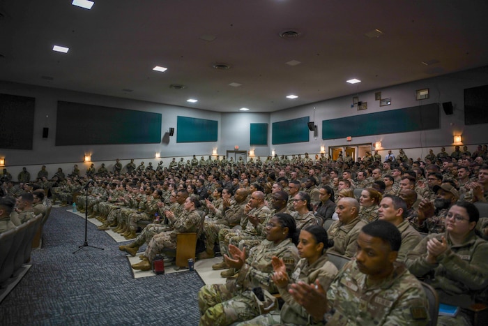 Audience members applaud CMSAF Wolfe during a speech at Joint Base Andrews, Md.