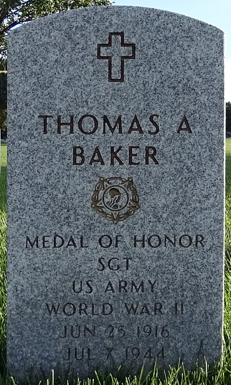 A headstone reads, "Thomas A. Baker, Medal of Honor, SGT, U.S. Army, World War II, June 25, 1916, July 7, 1944.”