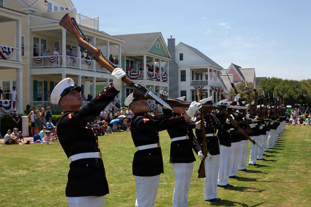 U.S. Marines with the United States Marine Corps Silent Drill Platoon, Marine Barracks Washington, prepare to perform for local residents as part of SAIL 250 in Norfolk, Virginia, June 21, 2026. SAIL250 Virginia celebrate America’s maritime heritage and the nation’s 250th anniversary by bringing together U.S. and international ships, Marines, Sailors, and community partners throughout Hampton Roads. (U.S. Marine Corps photo by Cpl. Xavier Alicea)