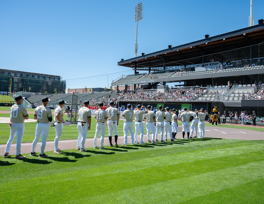 Participants gather on the field before an exhibition baseball game between the Utah National Guard and Hill Air Force Base at The Ballpark at America First Square in South Jordan, Utah, June 13, 2025. The event connected service members, community leaders and supporters through sports and conversations about resilience. (Utah National Guard photo by Master Sgt. Nicholas Perez)