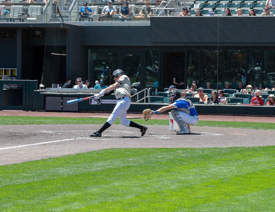 A Utah National Guard baseball player makes contact during an exhibition game against Hill Air Force Base at The Ballpark at America First Square in South Jordan, Utah, June 13, 2025. The game followed the "In the Open: Strength Beyond the Uniform" resilience event, which promoted mental health awareness, community engagement and service member well-being. (Utah National Guard photo by Master Sgt. Nicholas Perez)