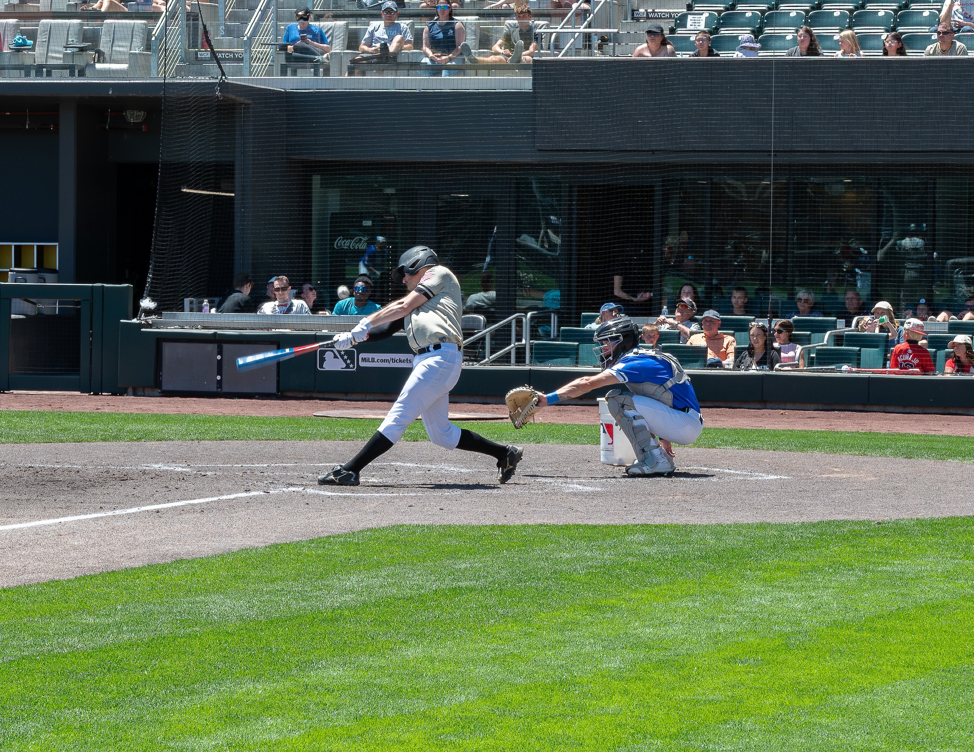A Utah National Guard baseball player makes contact during an exhibition game against Hill Air Force Base at The Ballpark at America First Square in South Jordan, Utah, June 13, 2025. The game followed the "In the Open: Strength Beyond the Uniform" resilience event, which promoted mental health awareness, community engagement and service member well-being. (Utah National Guard photo by Master Sgt. Nicholas Perez)