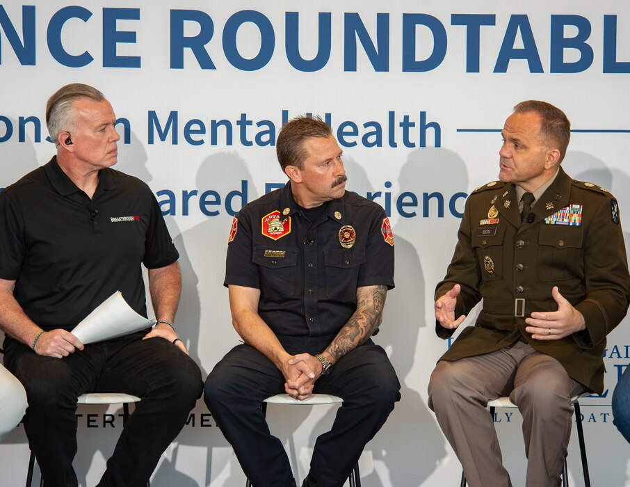 Lt. Col. John Isom, commander of the 300th Military Intelligence Brigade, speaks during the "In the Open: Strength Beyond the Uniform" resilience roundtable at The Ballpark at America First Square, June 13, 2025. Isom joined community leaders, first responders and former professional athletes in discussing mental health, resilience and the importance of seeking support. (Utah National Guard photo by Master Sgt. Nicholas Perez)