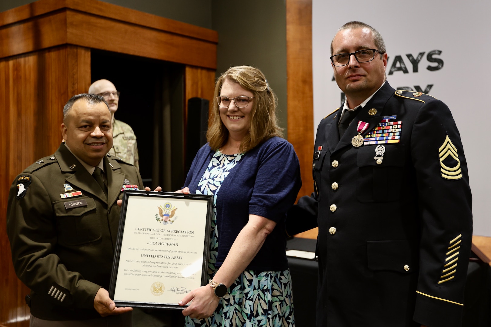 Brig. Gen. Jorge Fonseca, the Director of the Illinois National Guard Joint Staff, presents Jodi Hoffman with a Certificate of Appreciation signed by the U.S. Army Chief of Staff thanking her for her support of her husband, Illinois Army National Guard 1st Sgt. (ret.) Greg Hoffman, throughout his 27-year military career during Greg Hoffman’s June 6 retirement ceremony on Camp Lincoln in Springfield, Illinois.