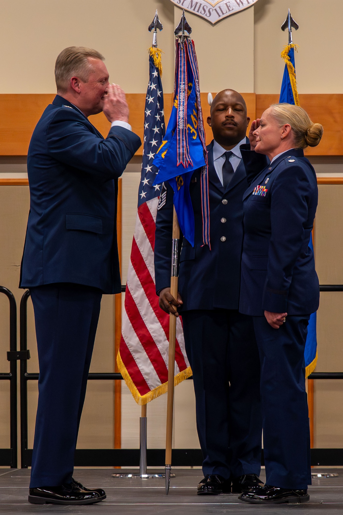U.S. Air Force Lt. Col. Melissa Anhalt, incoming commander of the 341st Operational Medical Readiness Squadron, right, salutes Col. Jason Tompkins, 341st Medical Group commander, during a change of command ceremony at Malmstrom Air Force Base, Montana, June 17, 2026.