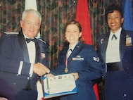 Then-Senior Airman Rebecca Velazquez receives recognition during her early years in the U.S. Air Force. Velazquez began her military career seeking adventure and opportunity, ultimately serving 27 years and retiring as the 183d Wing Command Chief, Illinois Air National Guard, before pursuing a new mission in mental health social work. (Courtesy photo)