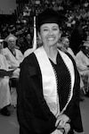 Chief Master Sgt. Rebecca Velazquez, then serving in the Illinois Air National Guard, poses during her graduation ceremony at Southern Illinois University Edwardsville. Velazquez earned a bachelor's degree in interdisciplinary studies with a focus on leadership, psychology and sociology, a milestone that helped inspire her pursuit of a Master of Social Work degree and a future career supporting veterans and underserved communities.