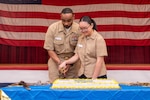PORTSMOUTH, Va. (June 17, 2026)  Master Chief Hospital Corpsman Louis Raiford and Hospitalman Apprentice Winnie Li, both assigned to Navy Medicine Readiness Training Command (NMRTC) Portsmouth, cut a cake during a ceremony for the hospital corpsman's 128th birthday at Naval Medical Center Portsmouth (NMCP), June 17, 2026. NMCP is the U.S. Navy’s premiere healthcare facility, having supported the maritime readiness of the U.S. Navy’s and U.S. Marine Corps’ forward-deployed units with high-quality medical care for nearly 200 years. NMRTC Portsmouth trains a staff of over 4,000 enlisted, commissioned, and civilian medical personnel across multiple specialties to provide high-quality medical care to patients at NMCP’s facilities and branch health clinics. (U.S. Navy photo by Mass Communication Specialist 2nd Class Thomas Boatright)