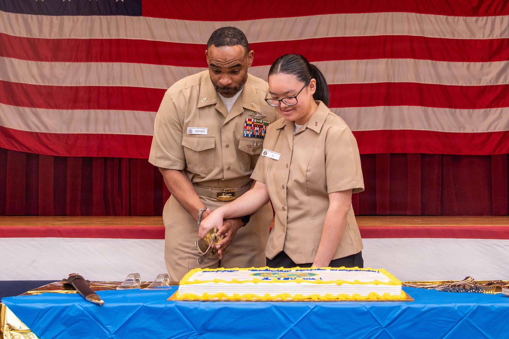 PORTSMOUTH, Va. (June 17, 2026)  Master Chief Hospital Corpsman Louis Raiford and Hospitalman Apprentice Winnie Li, both assigned to Navy Medicine Readiness Training Command (NMRTC) Portsmouth, cut a cake during a ceremony for the hospital corpsman's 128th birthday at Naval Medical Center Portsmouth (NMCP), June 17, 2026. NMCP is the U.S. Navy’s premiere healthcare facility, having supported the maritime readiness of the U.S. Navy’s and U.S. Marine Corps’ forward-deployed units with high-quality medical care for nearly 200 years. NMRTC Portsmouth trains a staff of over 4,000 enlisted, commissioned, and civilian medical personnel across multiple specialties to provide high-quality medical care to patients at NMCP’s facilities and branch health clinics. (U.S. Navy photo by Mass Communication Specialist 2nd Class Thomas Boatright)
