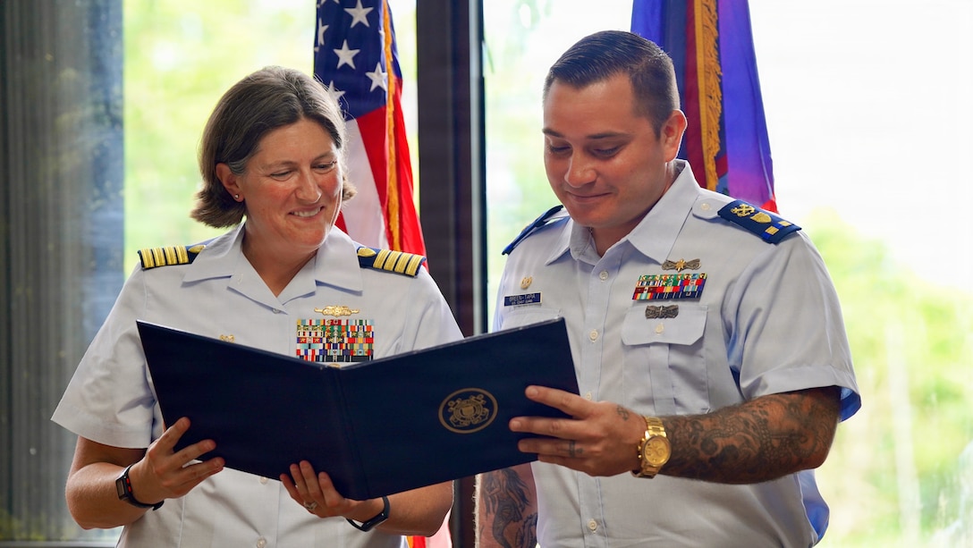 Senior Chief Petty Officer Calvin Hernandez assumes command of U.S. Coast Guard Station Apra Harbor from Chief Warrant Officer Kyle Breen-Tapia in a change of command ceremony at Top o’the Mar in Guam on June 23, 2026. Capt. Jessica Worst, commander of U.S. Coast Guard Forces Micronesia/Sector Guam, presided over the ceremony. During Breen-Tapia's tenure as officer-in-charge from June 2025 to June 2026, he led 51 active-duty and reserve personnel through more than 500 resource sorties and 2,500 underway hours across the remote waters of Micronesia, saving or assisting 106 lives. (U.S. Coast Guard photo by Lt. Sara Muir)