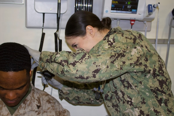 Hospitalman Chloe Gerimonte (right) provides care to a patient at the Adult Medical Care Clinic at Navy Medicine Readiness and Training Command Twentynine Palms aboard Marine Corps Air Ground Combat Center Twentynine Palms, California, April 1, 2026. Gerimonte serves as a Hospital Corpsman at the clinic, supporting patient care and medical readiness for Sailors and Marines. (U.S. Navy photo by Hospital Apprentice Evelyn Zermeno, NH/NMRTC Twentynine Palms public affairs).