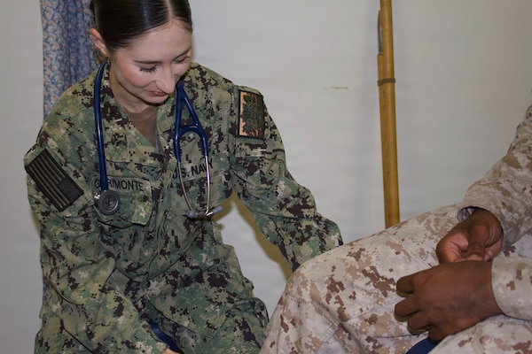 Hospitalman Chloe Gerimonte (left) provides care to a patient at the Adult Medical Care Clinic at Navy Medicine Readiness and Training Command Twentynine Palms aboard Marine Corps Air Ground Combat Center Twentynine Palms, California, April 1, 2026. Gerimonte previously worked at the clinic as a civilian contractor before joining the Navy Hospital Corps. (U.S. Navy photo by Hospital Apprentice Evelyn Zermeno, NH/NMRTC Twentynine Palms public affairs).