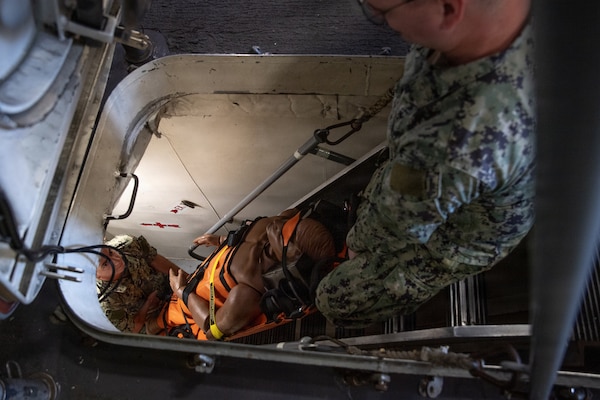 U.S. Navy Sailors assigned to Navy Medicine Readiness Training Command San Diego participate in a shipboard litter bearer training aboard the Freedom-class littoral combat ship USS Fort Worth (LCS-3), June 16. The evolution was part of Mercy Exercise (MERCEX) 26-3, a quarterly exercise strengthening critical integration and readiness between reduced operating status (ROS) and full operating status (FOS) USNS Mercy Sailors, supporting Navy Medicine’s line of effort to deliver and sustain ready naval medical forces. NMRTC San Diego supports Navy and Marine Corps readiness by ensuring its medical forces are ready to deploy and provide medical support, ashore or at sea. (U.S. Navy photo by Mass Communication Specialist 3rd Class Jason Afable)