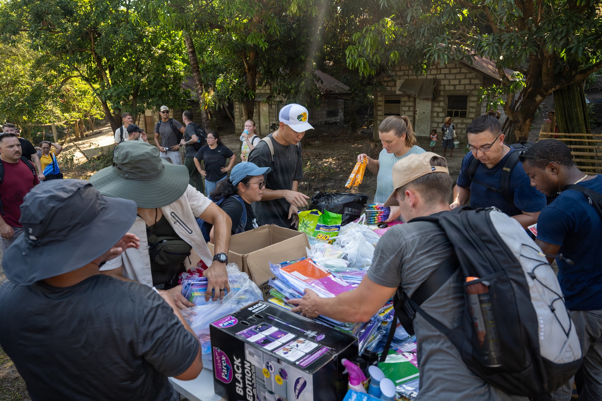 U.S. Airmen assigned to the 21st Air Expeditionary Wing arrange school supplies during a community outreach event in Haduan, Philippines, May 20, 2026. The outreach effort supported local educational opportunities and demonstrated the U.S. Air Force's commitment to community engagement and service beyond the operational mission. (U.S. Air Force photo by Senior Airman Adrien Tran)