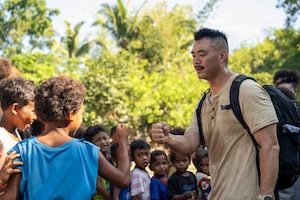 U.S. Air Force Capt. Joseph Jun, 21st Air Expeditionary Wing chaplain, greets children during a community outreach event in Haduan, Philippines, May 20, 2026. The 21st AEW conducted the outreach to foster goodwill and strengthen community relationships, highlighting the human dimension of the bilateral partnership between the U.S. and the Philippines. (U.S. Air Force photo by Senior Airman Adrien Tran)