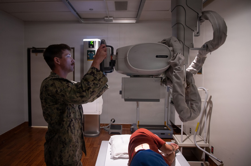 260617-N-MJ645-2102 Hospital Corpsman 2nd Class Johan Orion, a Radiologic Technologist assigned to Naval Medical Center San Diego, reviews a patient’s X-ray images at NMCSD, June 17, 2026. Radiologic Technologists play a vital role in supporting patient care by producing diagnostic images that assist healthcare providers in evaluating and treating medical conditions. The mission of NMCSD is to optimize health and enhance readiness. NMCSD employs more than 5,500 active-duty military personnel, civilians, and contractors in southern California to deliver exceptional care afloat and ashore. (U.S. Navy photo by Mass Communication Specialist 1st Class Marcus L. Stanley)