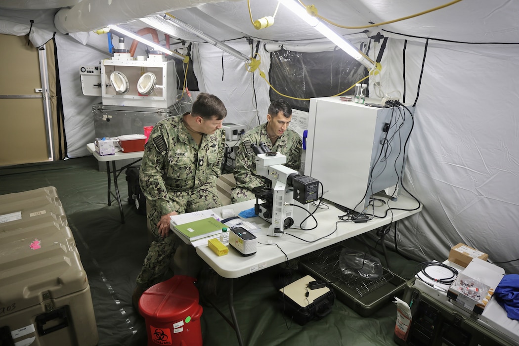 260606-N-XT273-1021 Chief Hospital Corpsman William Owens and Microbiologist Lt. Jordan Rede, assigned to Forward Deployable Preventive Medicine Unit (FDPMU) Team 2, setup samples for testing during a reconnaissance and decontamination training scenario with the Latvian National Guard Chemical, Biological, Radiological, and Nuclear Defense Unit during exercise Baltic Operations (BALTOPS) 2026, in Liepaja, Latvia, June 6, 2026. BALTOPS 2026, the premiere maritime-focused exercise in the Baltic Sea region, provides a unique training opportunity to strengthen combined response capabilities critical to preserving freedom of navigation and security in the Baltic Sea.