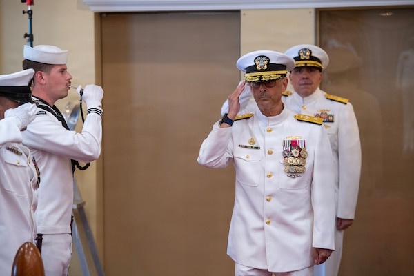 Rear Adm. Robert Hawkins, director of Defense Health Network Atlantic and commander of Naval Medical Forces Atlantic, is rung aboard as the presiding officer for the Navy Medicine Readiness and Training Command New England Change of Command ceremony aboard Naval Station Newport, R.I.,on June 10, 2026. (U.S. Navy photo by Mass Communication Specialist 1st Class Jacob Allison)